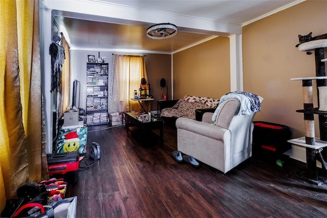 living room with wood-type flooring and ornamental molding