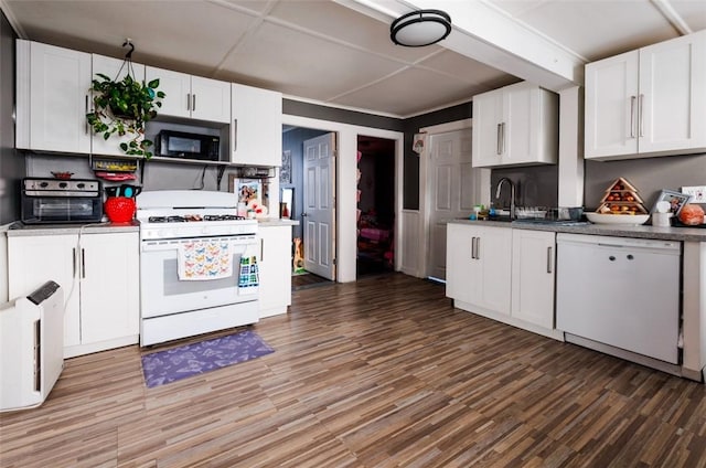 kitchen featuring hardwood / wood-style floors, white cabinets, and white appliances