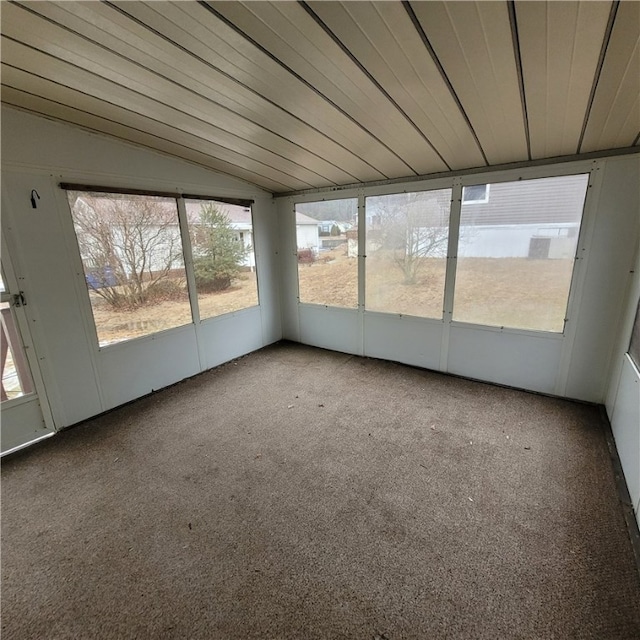 unfurnished sunroom featuring lofted ceiling and wood ceiling