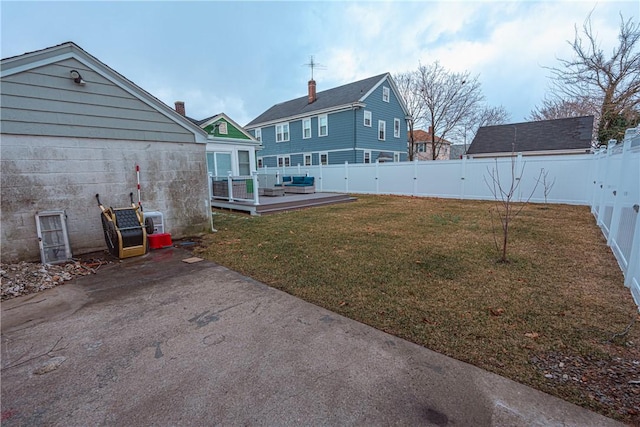 view of yard featuring a deck and a patio