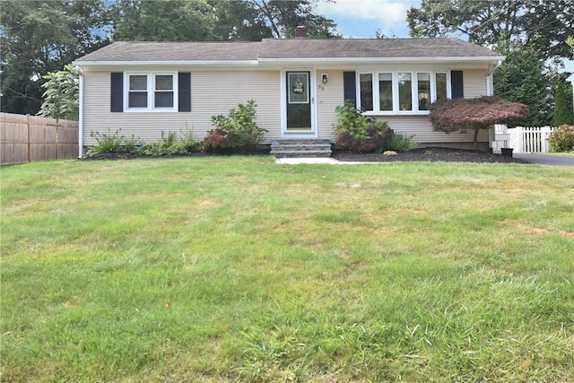 ranch-style home featuring a front yard