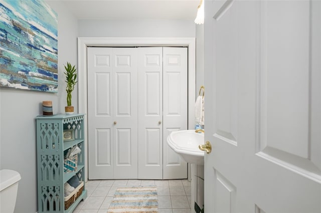 bathroom featuring tile patterned floors and toilet