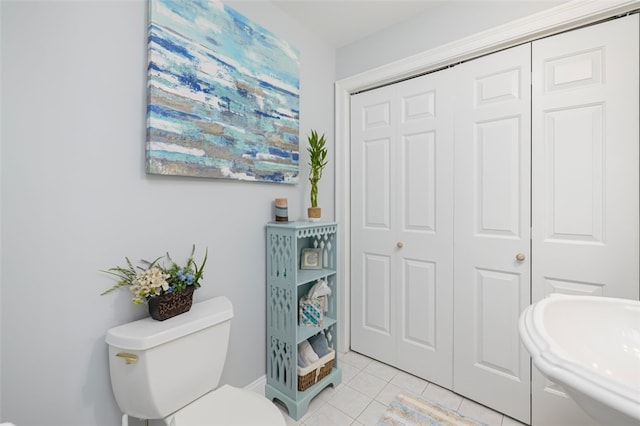 bathroom featuring tile patterned floors and toilet