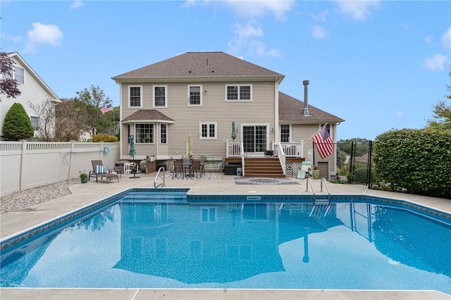 view of pool with a deck and a patio area