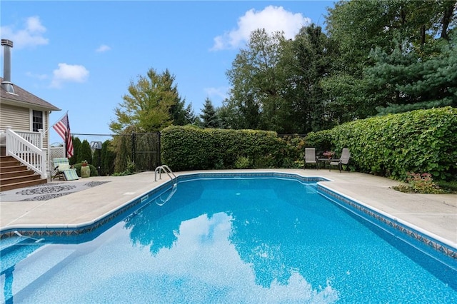 view of swimming pool with a patio area