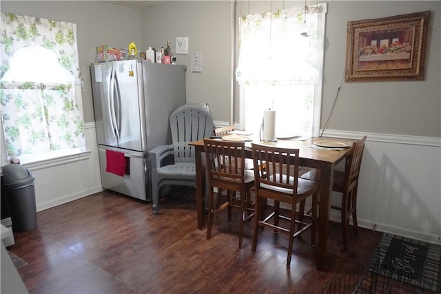 dining space with dark hardwood / wood-style floors