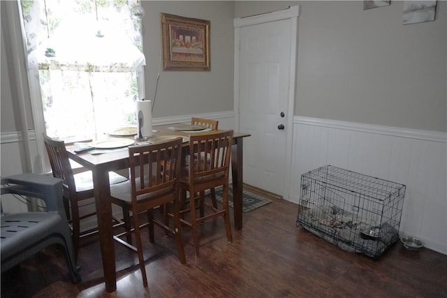 dining space with dark wood-type flooring