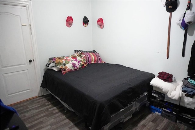 bedroom featuring dark hardwood / wood-style floors