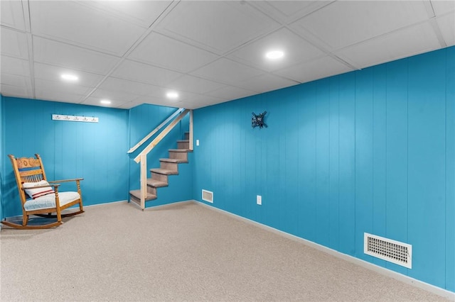 unfurnished room featuring a drop ceiling and carpet floors