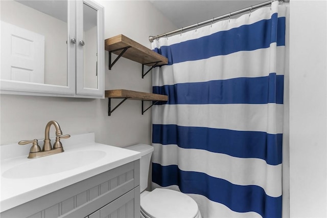 bathroom with vanity, toilet, and a shower with shower curtain