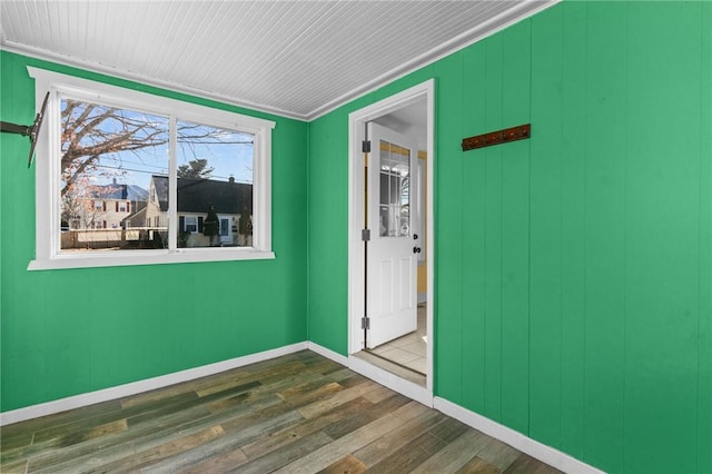 spare room with dark hardwood / wood-style flooring