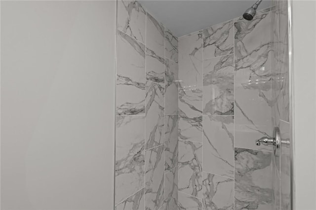 room details with a tile shower