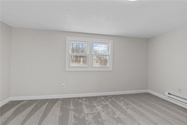 carpeted empty room with a baseboard radiator