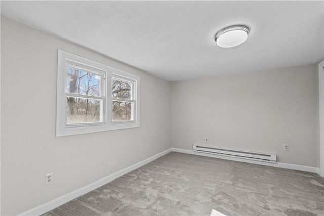 carpeted empty room featuring a baseboard radiator