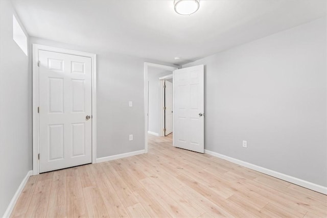 unfurnished bedroom with light wood-type flooring