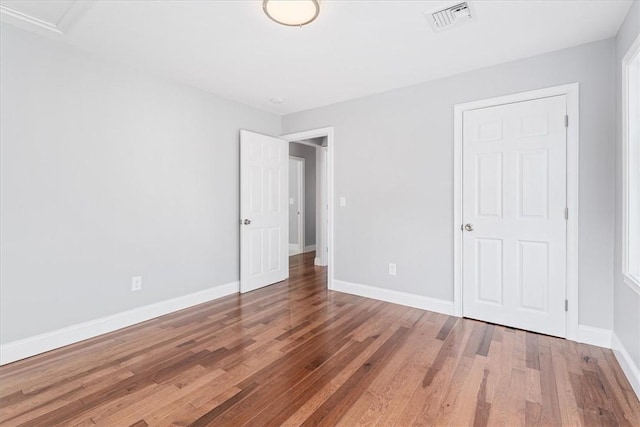 unfurnished bedroom featuring wood-type flooring