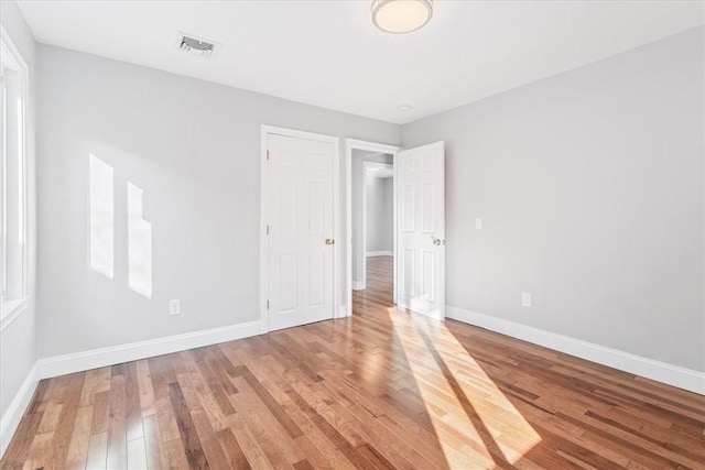 empty room featuring wood-type flooring