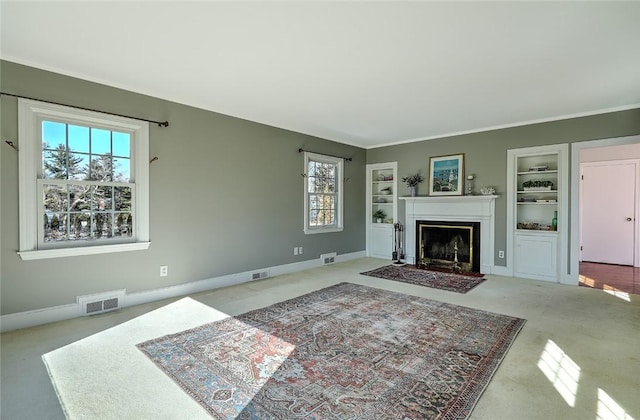 carpeted living room with built in shelves, a fireplace with flush hearth, visible vents, and baseboards