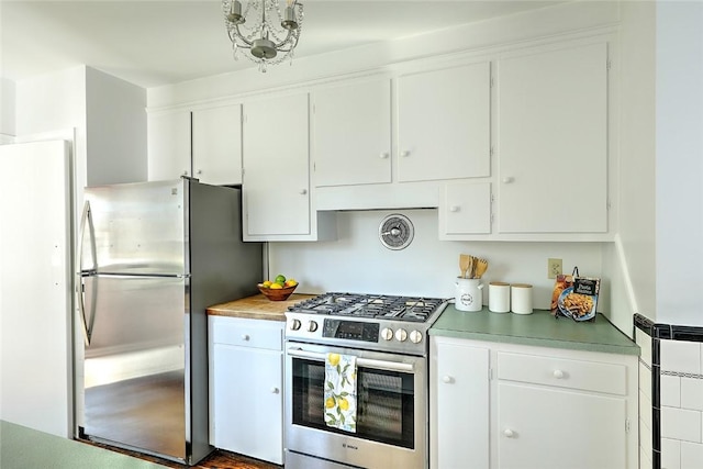 kitchen featuring light countertops, appliances with stainless steel finishes, and white cabinetry