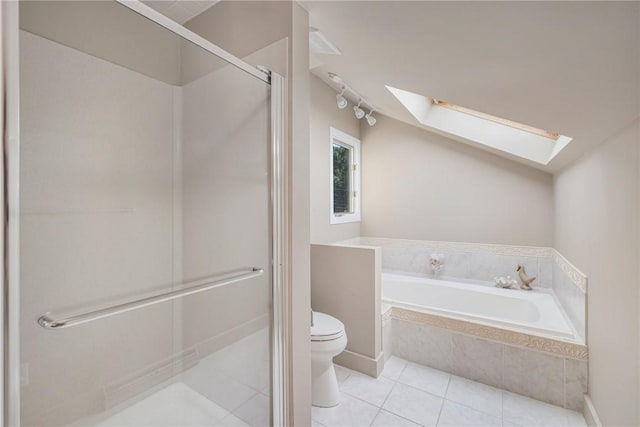 bathroom featuring independent shower and bath, toilet, tile patterned flooring, and a skylight