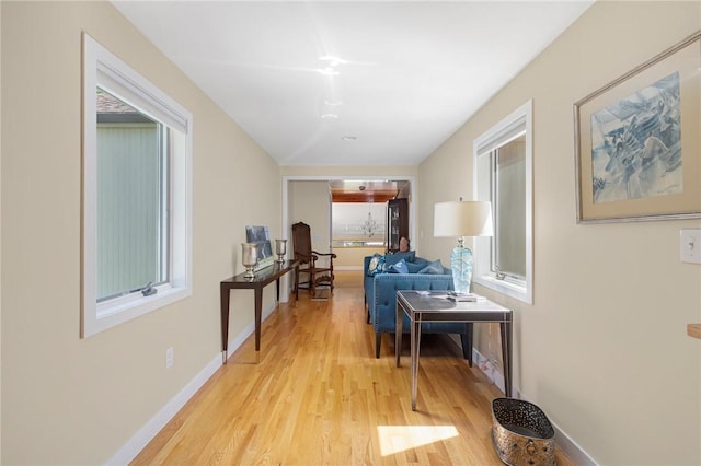 hall with light hardwood / wood-style floors