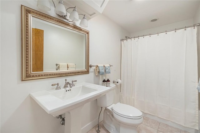 bathroom featuring tile patterned floors and toilet