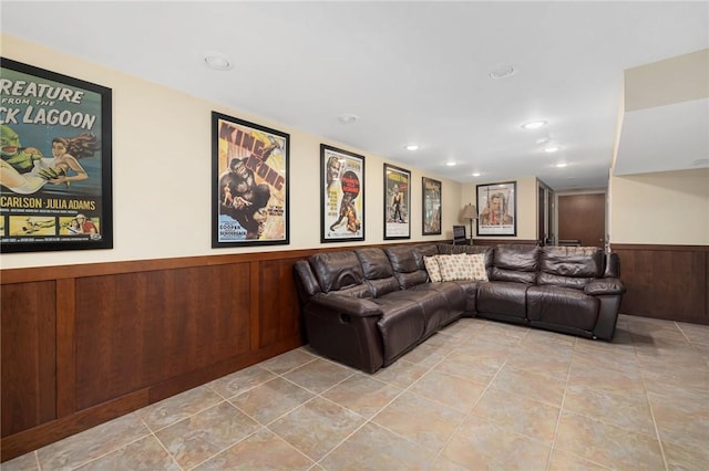 home theater room featuring wood walls