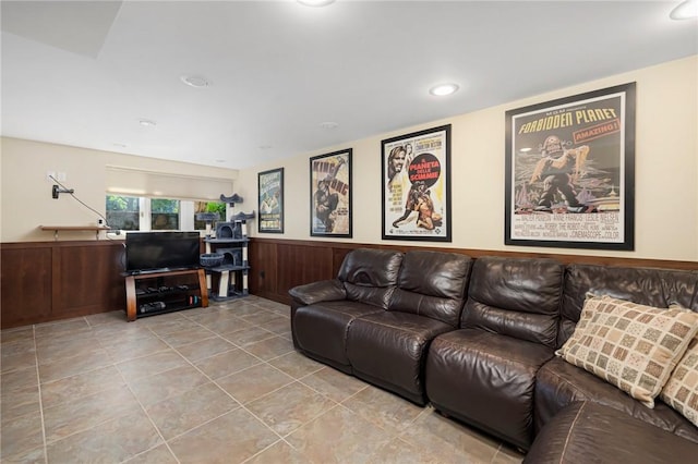 tiled living room featuring wooden walls