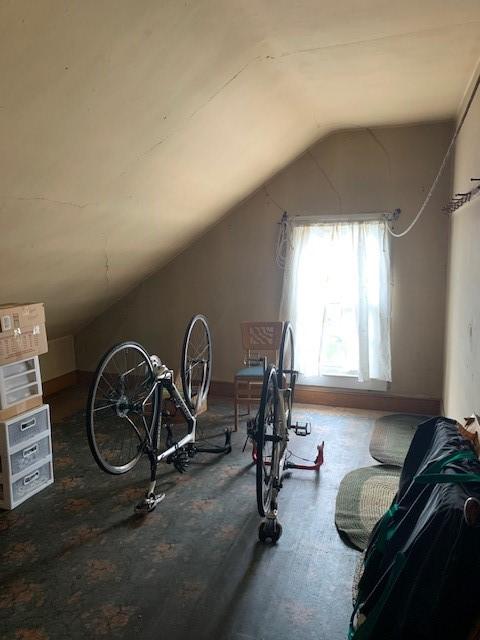 workout area featuring lofted ceiling