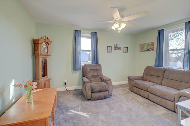 living room featuring light carpet and ceiling fan