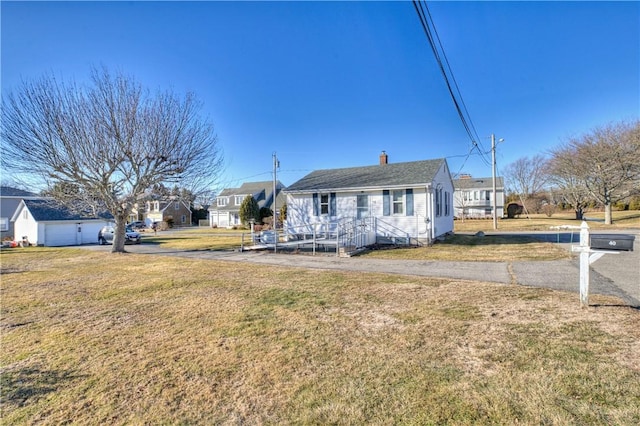 view of front of home featuring a front yard