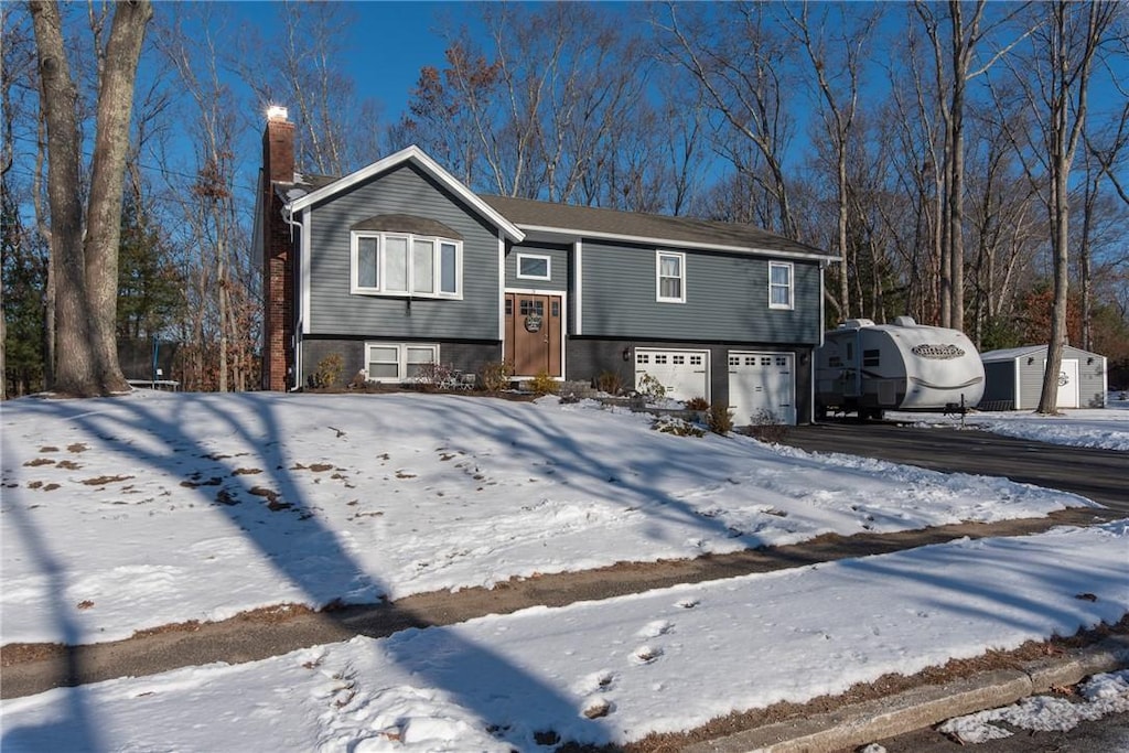 split foyer home featuring a garage