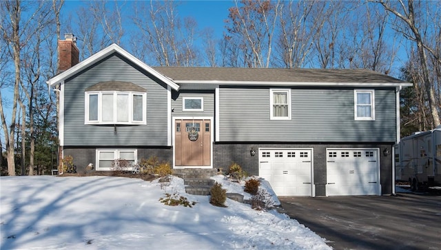 bi-level home featuring a garage