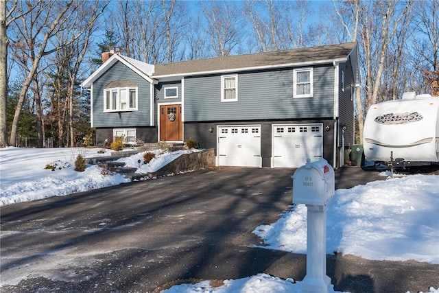 split foyer home featuring a garage