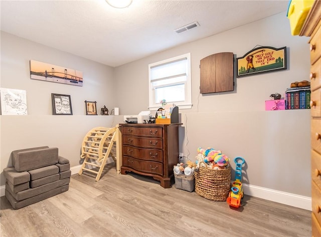 living area with light hardwood / wood-style floors