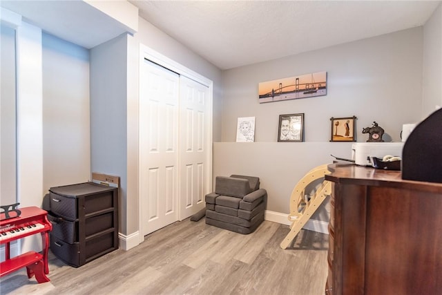 office space with light hardwood / wood-style flooring