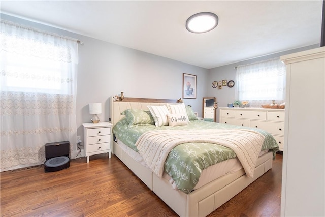 bedroom featuring dark hardwood / wood-style flooring