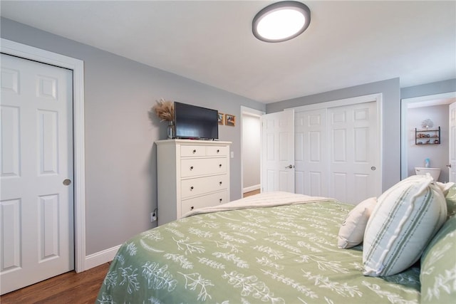 bedroom featuring dark hardwood / wood-style flooring and a closet