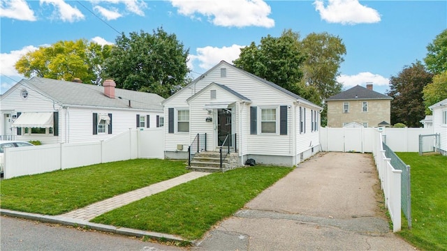 bungalow-style house with a front yard