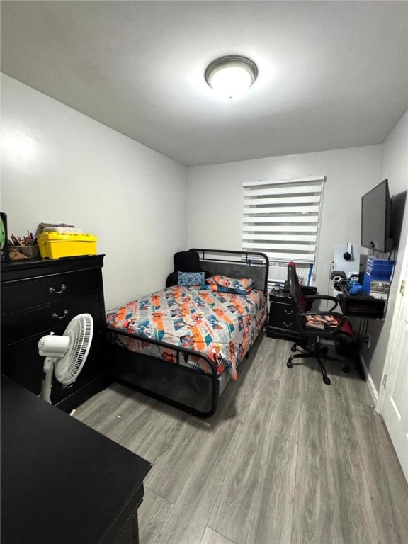 bedroom with light hardwood / wood-style floors