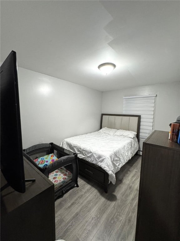 bedroom with hardwood / wood-style flooring