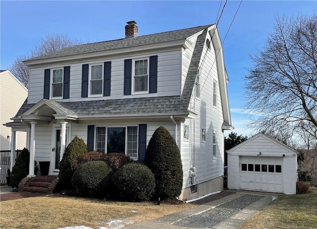 front facade with a garage and an outdoor structure