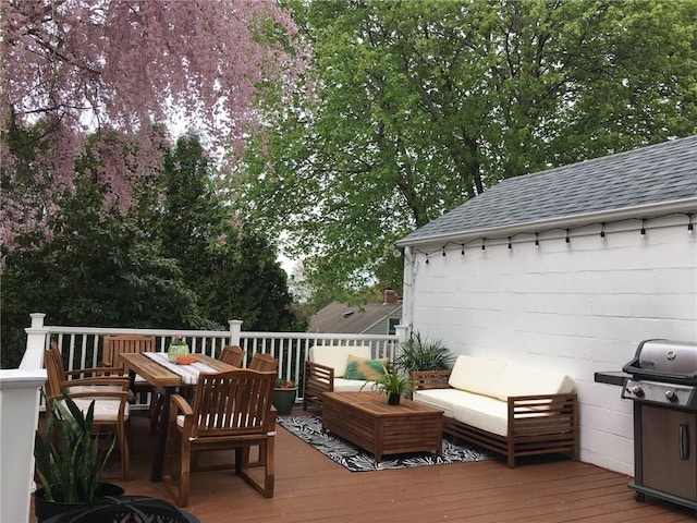 wooden terrace featuring outdoor lounge area and grilling area