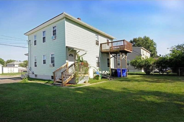 back of house with a lawn