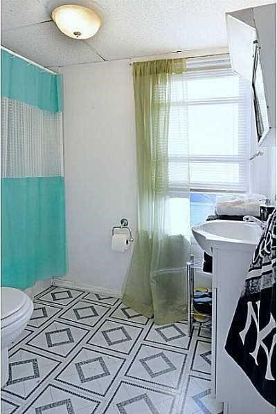 bathroom with vanity, walk in shower, a textured ceiling, and toilet