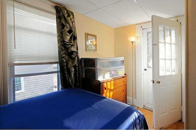 bedroom featuring parquet flooring