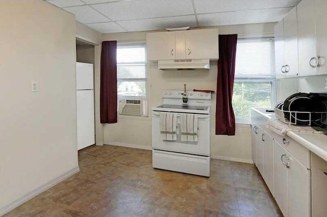 kitchen featuring white cabinetry, cooling unit, white appliances, and a drop ceiling