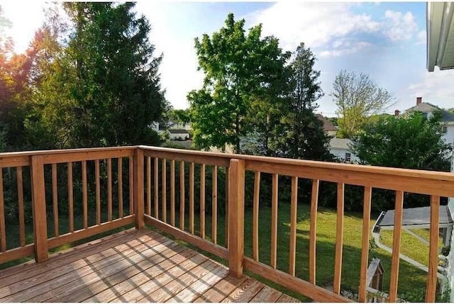 deck featuring a lawn