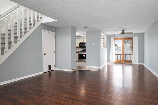 unfurnished living room featuring dark hardwood / wood-style floors and ceiling fan