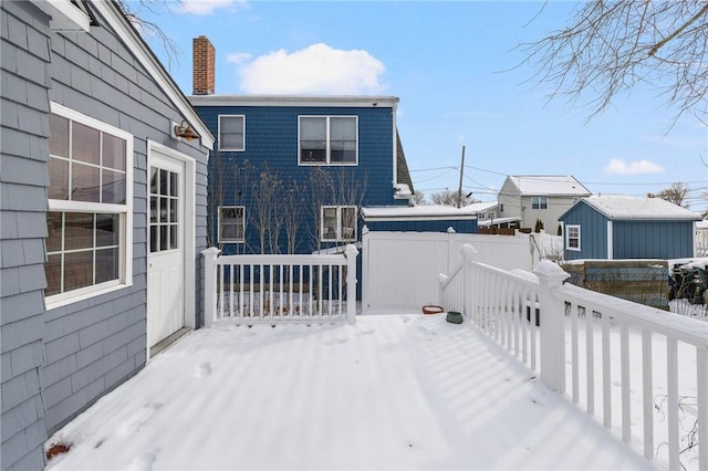 view of snow covered deck